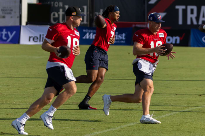 Texans quarterback Case Keenum and quarterback C.J. Stroud and quarterback Davis Mills (10) practice handoffs during training camp at the Houston Methodist Training Center.